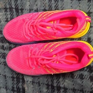 Pink yellow and blue tennis shoes